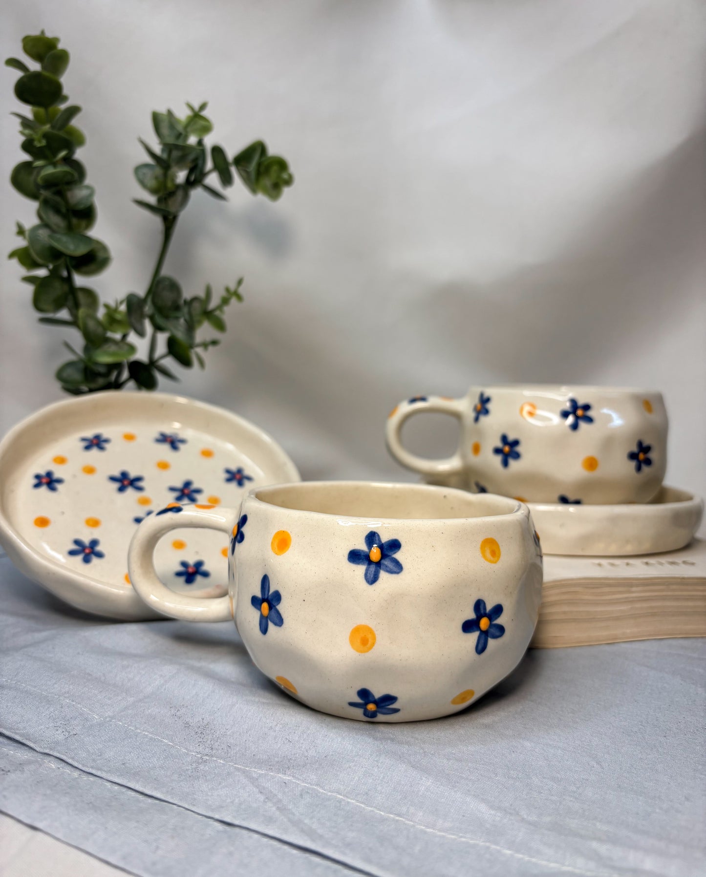 Handmade Ceramic Cup with Saucer – Blue Daisy & Sunshine Dots | Pankhhari Home