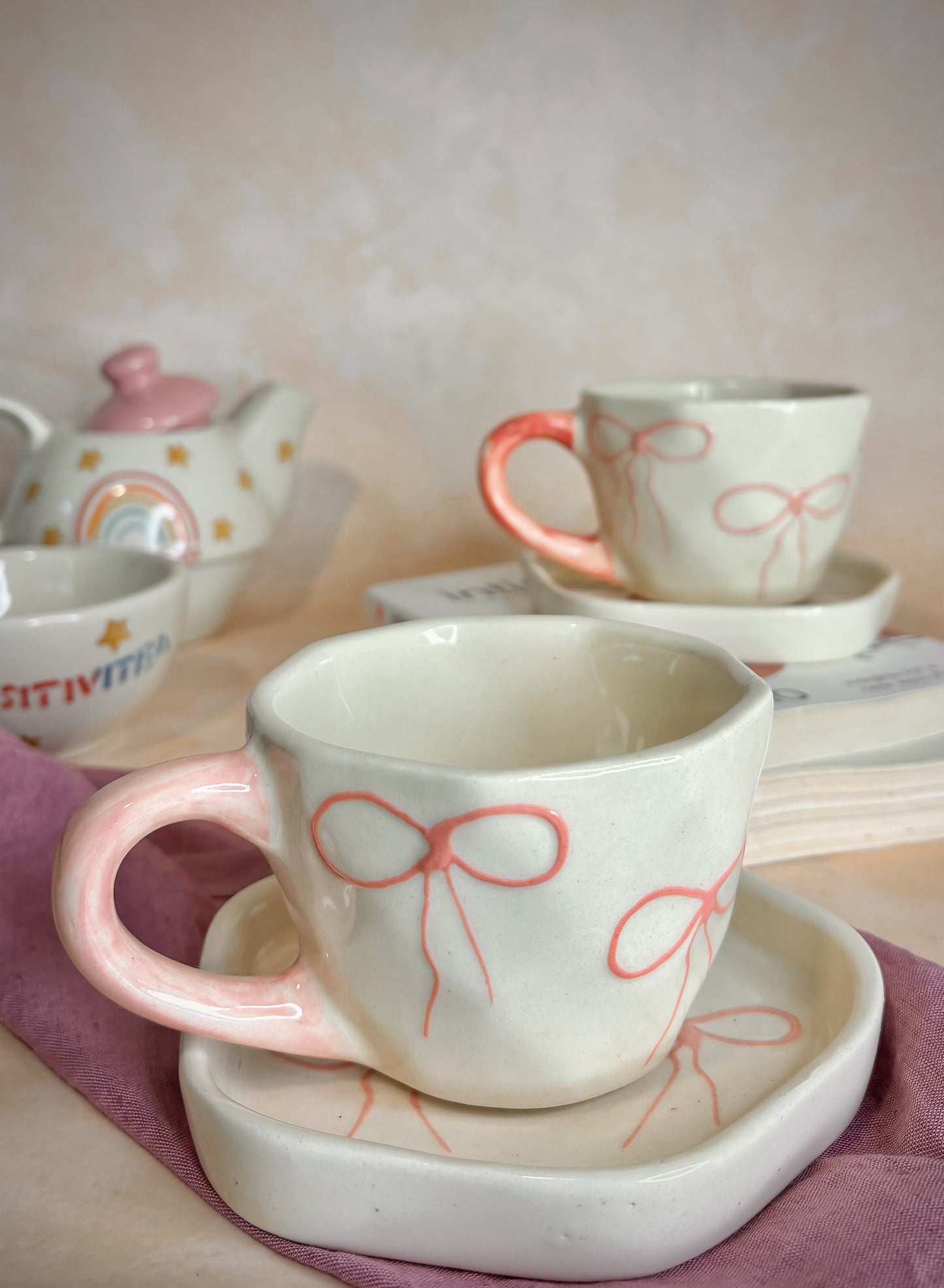 Handmade Ceramic Cup & Saucer Set with Pink Bow Design – Minimalist Pottery
