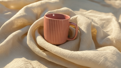 Luxury ribbed ceramic mug in pastel butter yellow, blush pink, and grey blue — handmade by Pankhhari